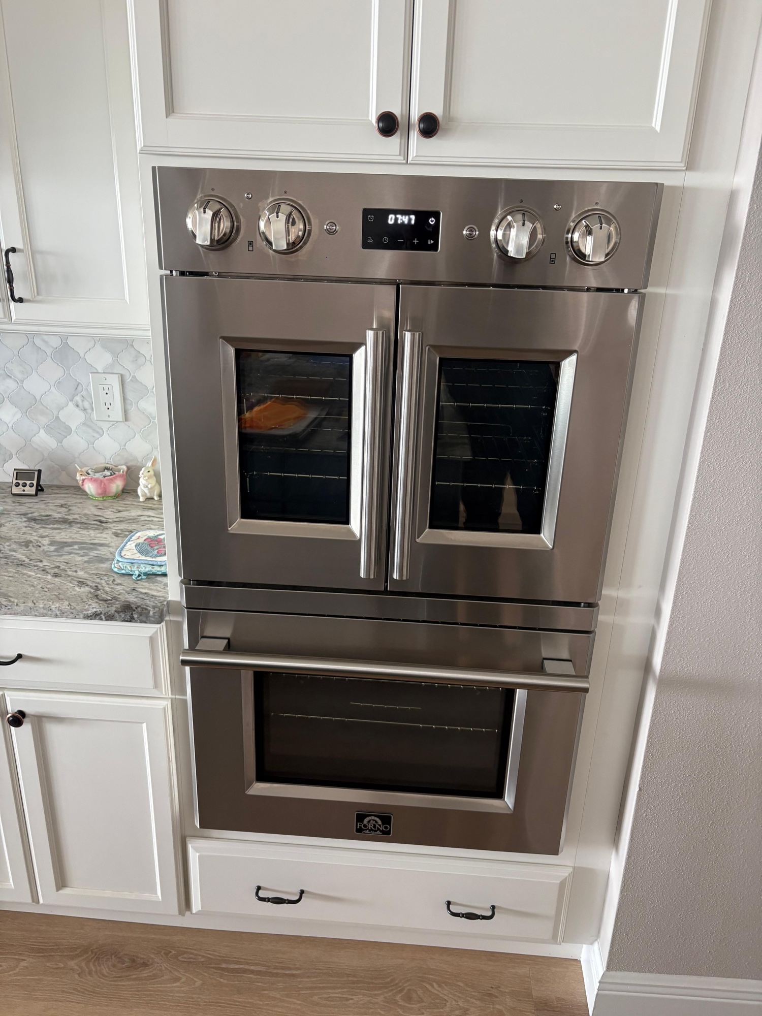 Forno French door double wall oven installed in white traditional kitchen